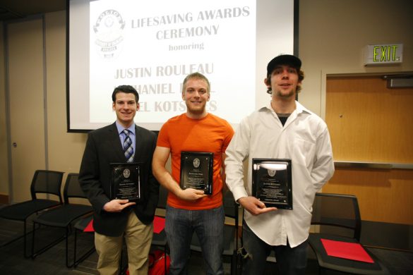 From left, Daniel Kotsides, a community safety officer, Nathaniel Pohl, a residential advisor, and Justin Rouleau, a cook in the C4C, pose for a photo at after receiving their Lifesaving Awards. The three students received the award for saving an 80-year-old man's life, using the Heimlich manuever, CPR and a defribrillator. (Kai Casey/CU Independent)