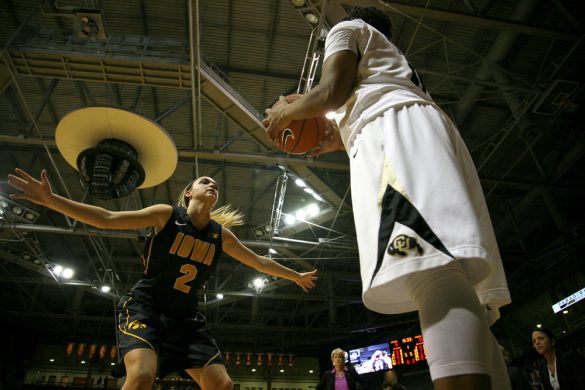 Colorado's Brittany Wilson (11) looks to inbound the ball as Iowa's Ally Disterhoft (2) defends. (Kai Casey/CU Independent)