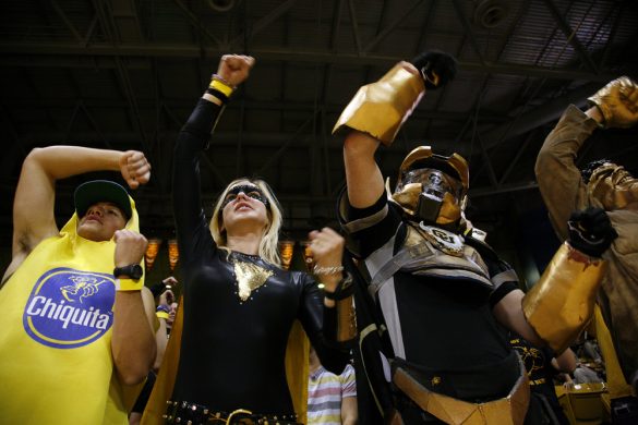 Members of the C-Unit cheer after the Buffs made a free throw. (Kai Casey/CU Independent)