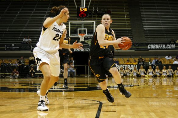 Iowa's Samantha Logic (22) tries to keep the ball away from Jasmine Sborov (21) as she drives toward the hoop in the second half. Logic had a game-high 26 points, tied with Colorado's Brittany Wilson. (Kai Casey/CU Independent)