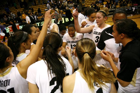 Ashley Wilson (12) talks to her team after they beat Iowa 90-87. Despite leading by as many as 19 points, CU was only able to beat Iowa by three. (Kai Casey/CU Independent)