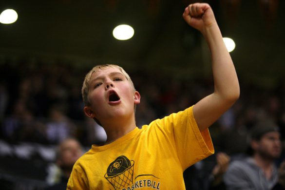 A young Colorado fan cheers after the Buffs started to pull away late. (Kai Casey/CU Independent)