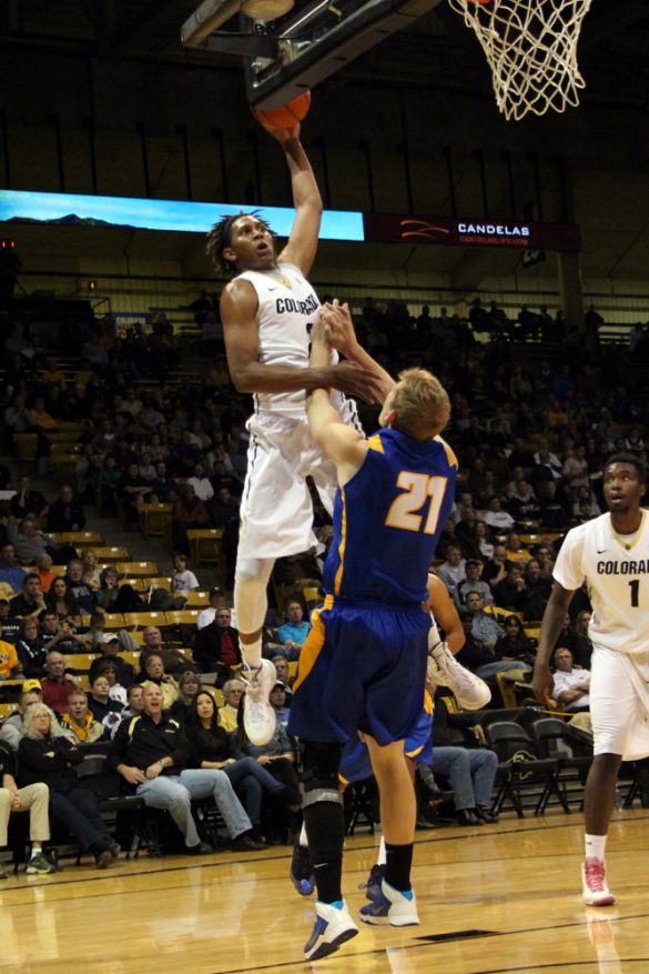 Xavier Johnson (2) tries to dunk from outside the lane over UCSB's Mitch Brewe (21). (Gray Bender/CU Independent)