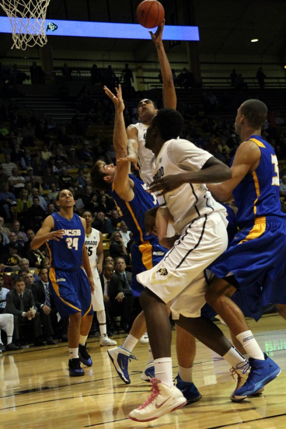 Josh Scott (40) goes up for a hook shot in the lane. (Gray Bender/CU Independent)