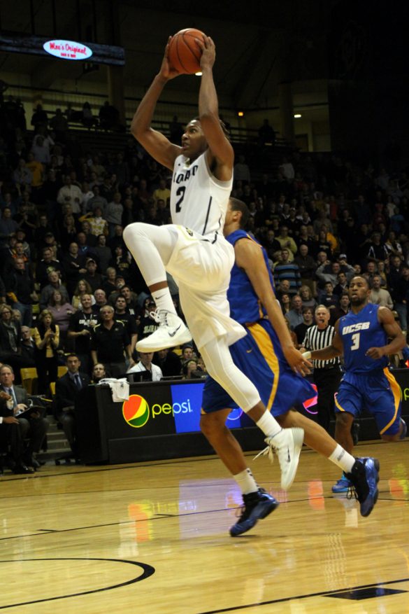 Xavier Johnson (2) jumps for a dunk from inside the free throw line. (Gray Bender/CU Independent)