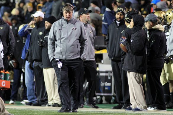 Colorado head coach Mike MacIntyre paces on the sideline in cold weather. (Nigel Amstock/CU Independent)