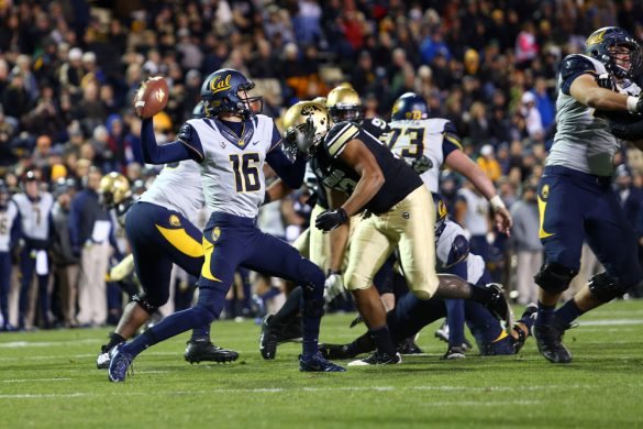 Quarterback Jared Goff (16) passes downfield just before getting hit by Samson Kafovalu (93). (Nigel Amstock/CU Independent)