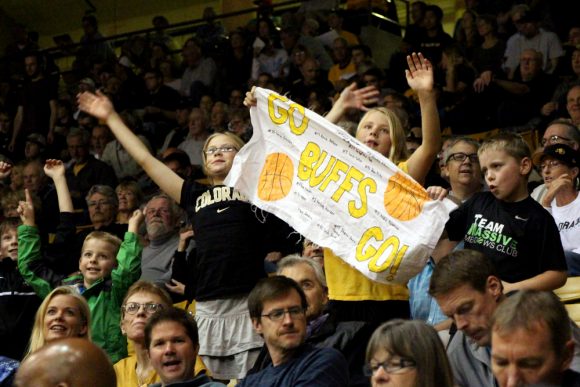 CU fans hold up a sign cheering on the Buffs during the first half. (Gray Bender/CU Independent)