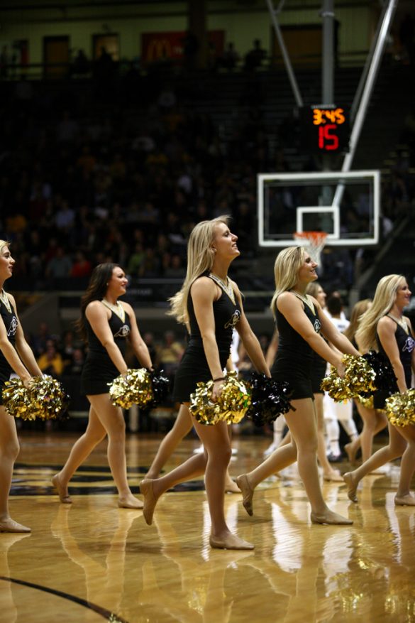 The CU dance team pumps up the crowd during a timeout. (Gray