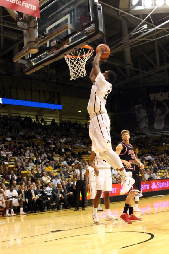 Jaron Hopkins (23) dunks the ball during the second half against Arkansas State. (Gray Bender/CU Independent)
