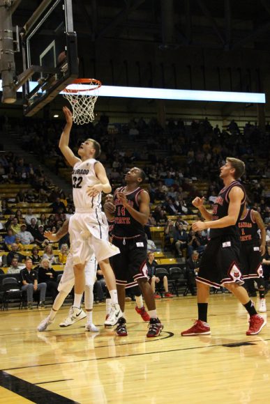 Forward Ben Mills (32) shoots a lay up during the first half. (Gray Bender/CU Independent)