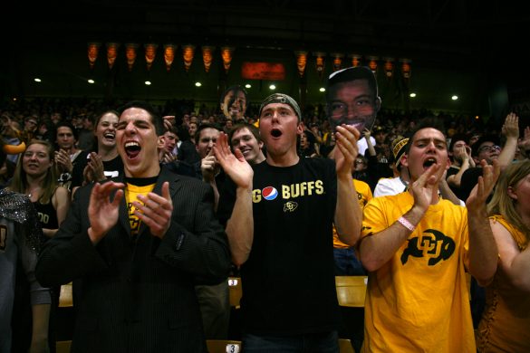 The C-Unit explodes into applause after the Buffs extended their lead in the first half. The Coors Events Center was fairly packed despite it being winter break, with an attendence of 10,848. (Kai Casey/CU Independent)