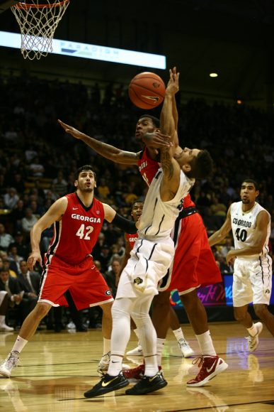 Junior guard Askia Booker (0) reacts after being fouled by Georgia's Donte' Williams (15). (Kai Casey/CU Independent)