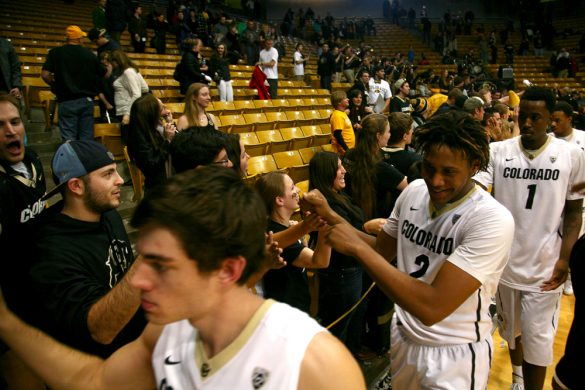 Colorado sophomore forward Xavier Johnson (2) high fives fans after the 14-point win over Georgia. (Kai Casey/CU Independent)