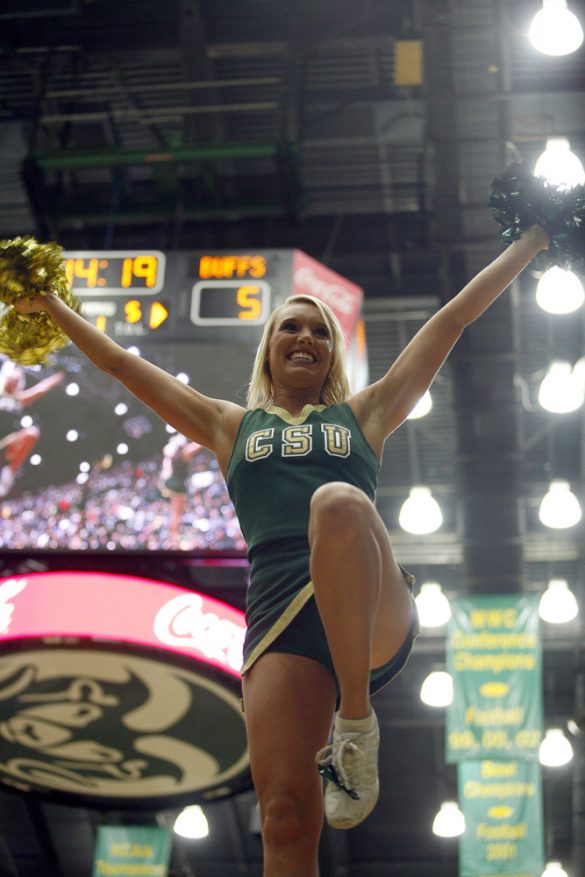 A CSU cheerleader pumps up the crowd in the first half. (Kai Casey/CU Independent)
