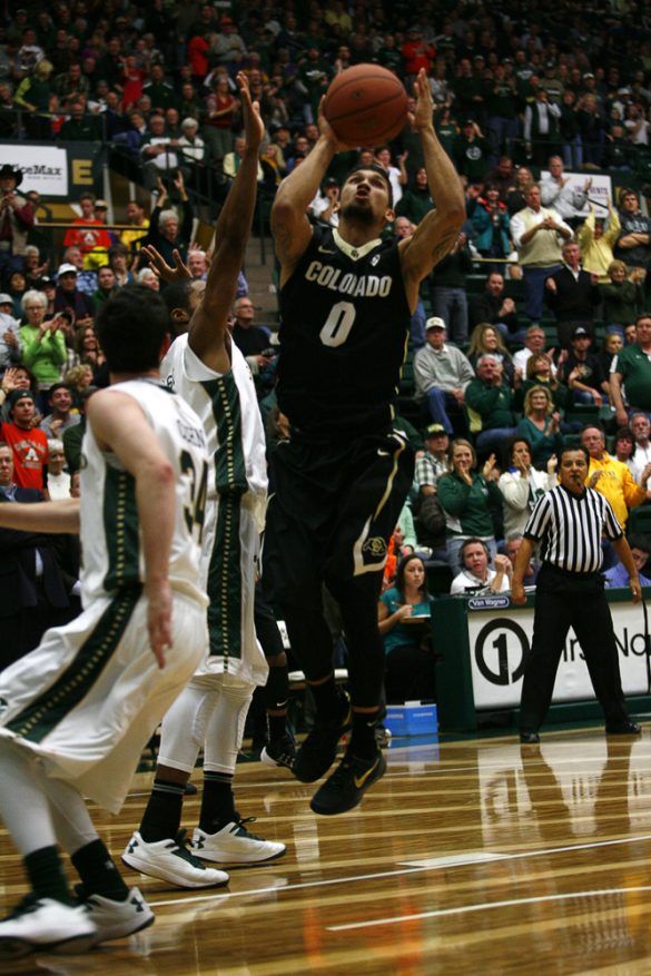 Junior guard Askia Booker (0) jumps from outside the lane to take a shot. Booker shot 0-for-6 from 3-point range, but still managed to score 12 points, good for second best for the Buffs. (Kai Casey/CU Independent)