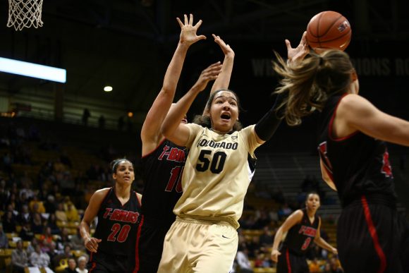 Colorado forward Jamee Swan (50) tries to control the ball while being defended by Southern Utah forward Carli Moreland (15). (Kai Casey/CU Independent)
