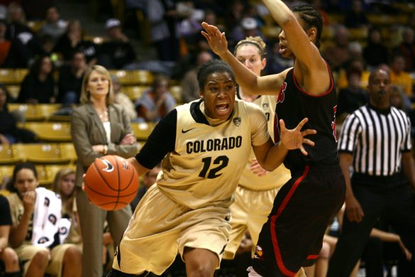 Colorado senior guard Ashley Wilson (12) tries to get past Southern Utah's Desiree Jackson (3). (Kai Casey/CU Independent)