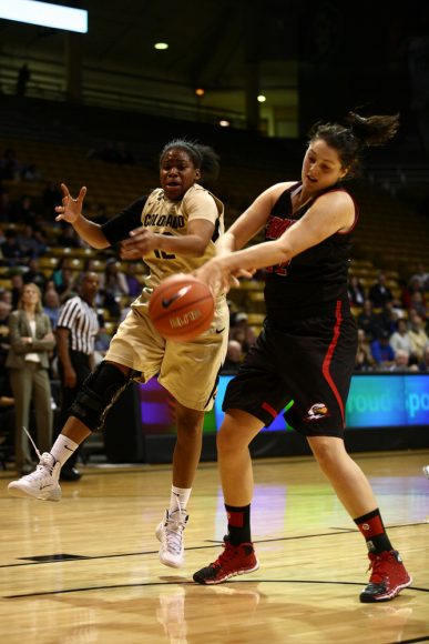 Colorado's Ashley Wilson (12) and Southern Utah's Brenna Gates (52) go for a loose ball. (Kai Casey/CU Independent)
