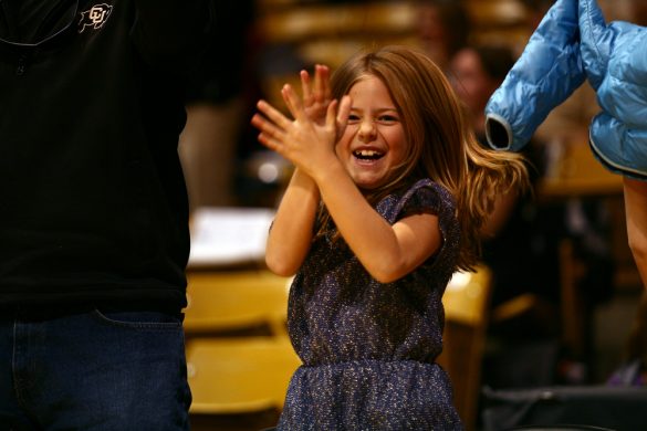 A young Colorado fan is ecstatic after the Buffs started to build their lead in the second half. (Kai Casey/CU Independent)