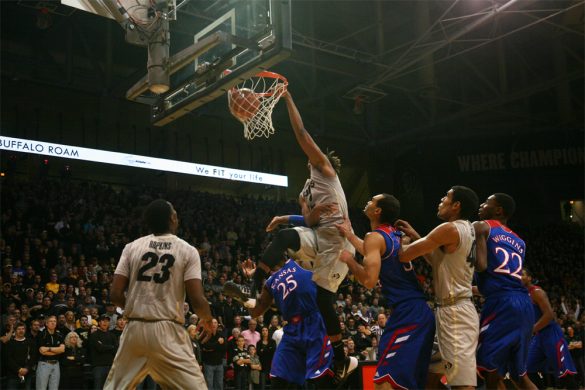 Xavier Johnson (2) dunks over a Kansas defender for the Buffs first points of the game. (Nate Bruzdzinski/CU Independent)