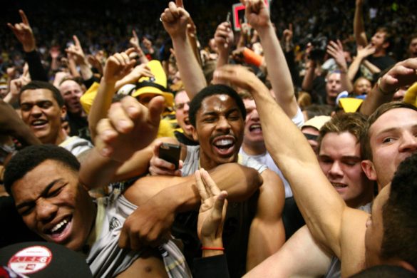 Spencer Dinwiddie celebrates with Askia Booker after the Buffs 75-72 win over Kansas. Booker hit a last second three-pointer to edge the Buffs past the Jayhawks.