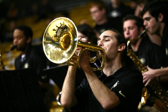 A member of the Buff Basketball Band plays the trumpet before the game. (Kai Casey/CU Independent)