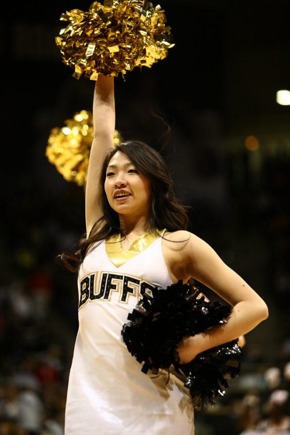A CU cheerleader performs just before the start of the game. (Kai Casey/CU Independent)