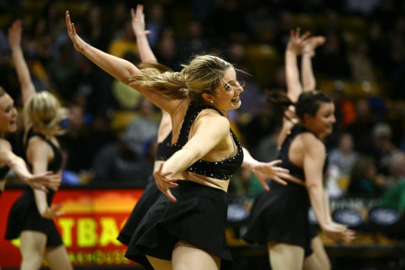 A member of the Colorado dance team performs during halftime. (Kai Casey/CU Independent)