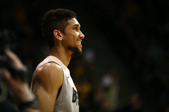 Colorado junior guard Askia Booker (0) smiles after making the bucket and getting fouled. (Kai Casey/CU Independent)