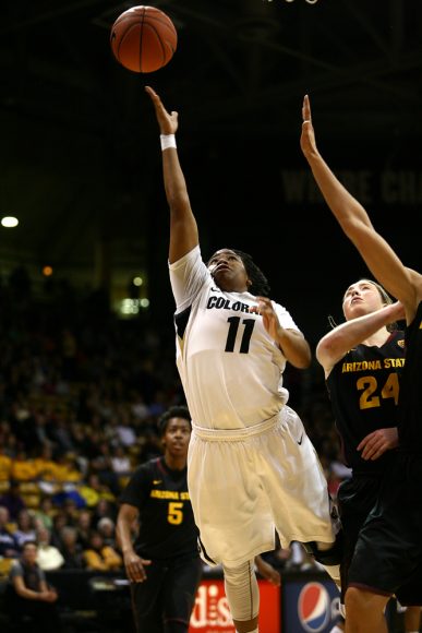Colorado senior guard Brittany Wilson (11) puts up a layup past Arizona State's Kelsey Moos (24). (Kai Casey/CU Independent)