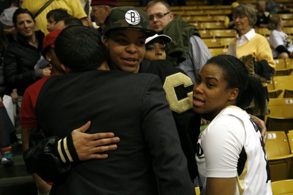 Colorado senior guard Ashley Wilson, right, hugs former CU women's basketball star and current WNBA player Chucky Jeffery after losing to No. 14 Arizona State. (Kai Casey/CU Independent)