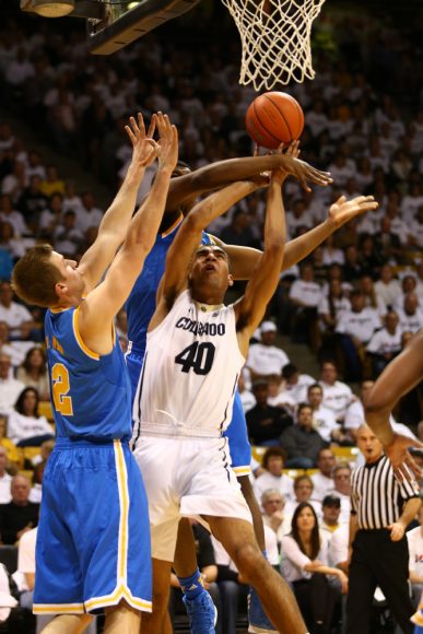 Colorado forward Josh Scott (40) is fouled by a UCLA defender while going up for the basket. (Nigel Amstock/CU Independent)