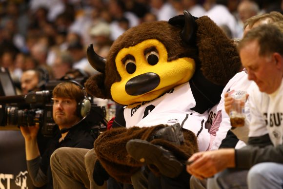 CU Mascot "Chip" poses for a photo atop two fans in the front row. (Nigel Amstock/CU Independent)
