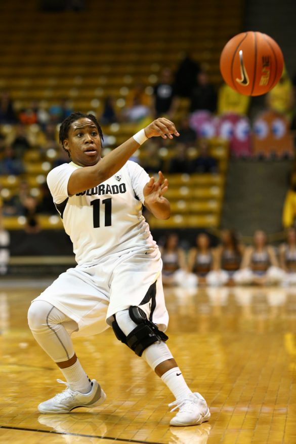 Senior guard Brittany Wilson passes the ball at the Coors Event Center. (Nigel Amstock/CU Independent)