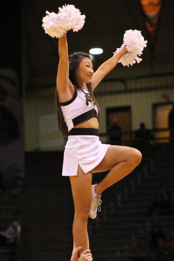 A Colorado cheer squad member pumps up the crowd in the first half. (Maddie Shumway/CU Independent)