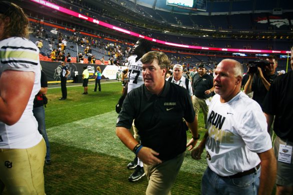 Colorado head coach Mike MacIntyre leaves the field following his first game, a 41-27 victory over in-state rival Colorado State on Sept. 1, 2013. (James Bradbury/CU Independent)
