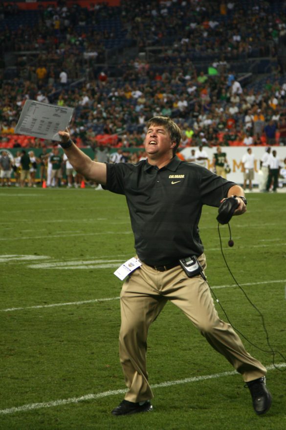 Coach Mike MacIntyre celebrates as the officials signal a turnover on downs giving the Buffs possession late in the fourth quarter of their 41-27 victory over Colorado State on Sept. 1, 2013. (James Bradbury/CU Independent)