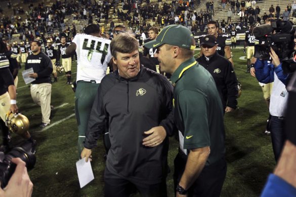 Colorado head coach Mike MacIntyre speaks to Oregon head coach Mark Helfrich after the game between Colorado and Oregon at Folsom Field, Saturday, Oct. 5, 2013. (Kai Casey/CU Independent)