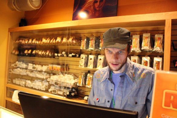 Jacob, last name not given, a manager at the Terrapin Care Station, looks up a customer's request on the computer. Karing Kind, a recreational pot shop north of Boulder, was the first to open in Boulder County. (Kai Casey/CU Independent)
