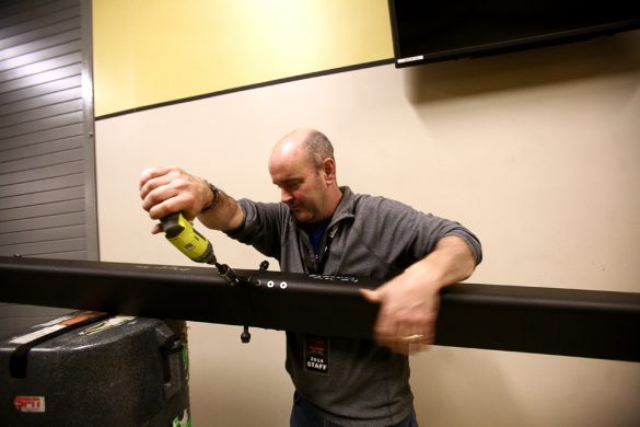 David Barnes, a rigger, sets up a jimmy jib to hold a camera for the College GameDay set in the Coors Events Center. (Kai Casey/CU Independent)