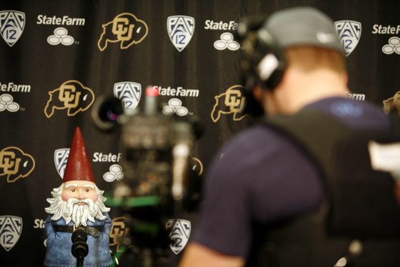 A ESPN cameraman shoots video of the Travelocity Gnome during a mock press conference for the ESPN College GameDay broadcast at the Coors Events Center, Saturday, Feb. 22, 2014, in Boulder, Colo. (Kai Casey/CU Independent)