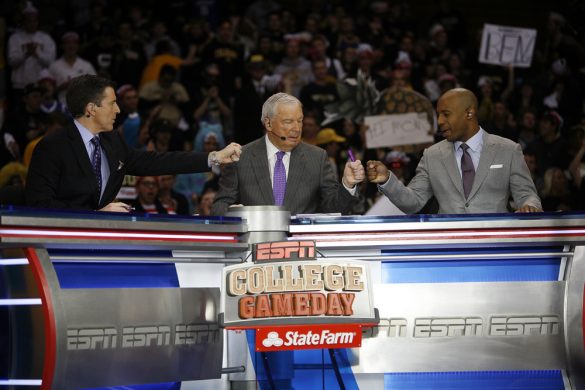 From left to right, Rece Davis, anchor of College GameDay, Digger Phelps and Jay Williams give each other a good luck fist bump before the ESPN College GameDay broadcast at the Coors Events Center, Saturday, Feb. 22, 2014, in Boulder, Colo. (Kai Casey/CU Independent)