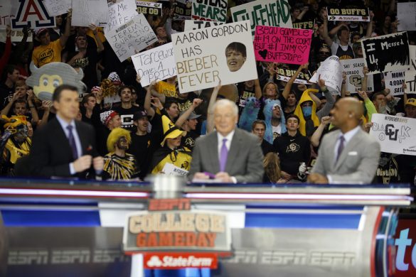 Colorado fans hold up creative signs in support of their Buffs behind Rece Davis, Digger Phelps and Jay Williams during the ESPN College GameDay broadcast at the Coors Events Center, Saturday, Feb. 22, 2014, in Boulder, Colo. (Kai Casey/CU Independent)