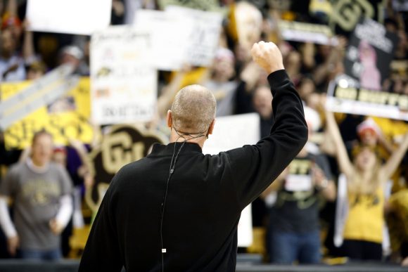 Colorado head coach Tad Boyle raises his hand in appreciation of the fans' support during the ESPN College GameDay broadcast at the Coors Events Center, Saturday, Feb. 22, 2014, in Boulder, Colo. (Kai Casey/CU Independent)