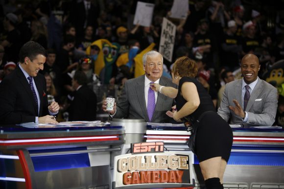 Rece Davis, left, and Jay Williams, right, laugh as Digger Phelps jokes while getting his tie fixed during the ESPN College GameDay broadcast at the Coors Events Center, Saturday, Feb. 22, 2014, in Boulder, Colo. (Kai Casey/CU Independent)