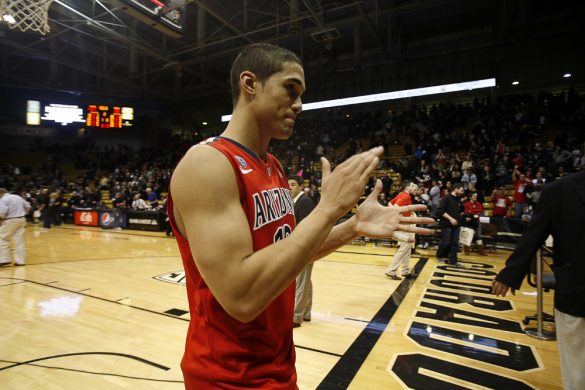 Arizona guard Nick Johnson (13) applauds toward the Arizona fans after demolishing Colorado an NCAA college basketball game between the Colorado Buffaloes and the No. 4 Arizona Wildcats at the Coors Events Center, Saturday, Feb. 22, 2014, in Boulder, Colo. (Kai Casey/CU Independent)