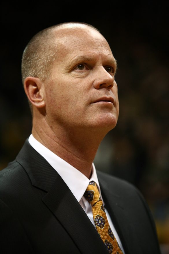 Colorado head coach Tad Boyle watches a highlight video of his senior basketball players on Senior Day during an NCAA college basketball game between the Colorado Buffaloes and the No. 4 Arizona Wildcats at the Coors Events Center, Saturday, Feb. 22, 2014, in Boulder, Colo. (Kai Casey/CU Independent)