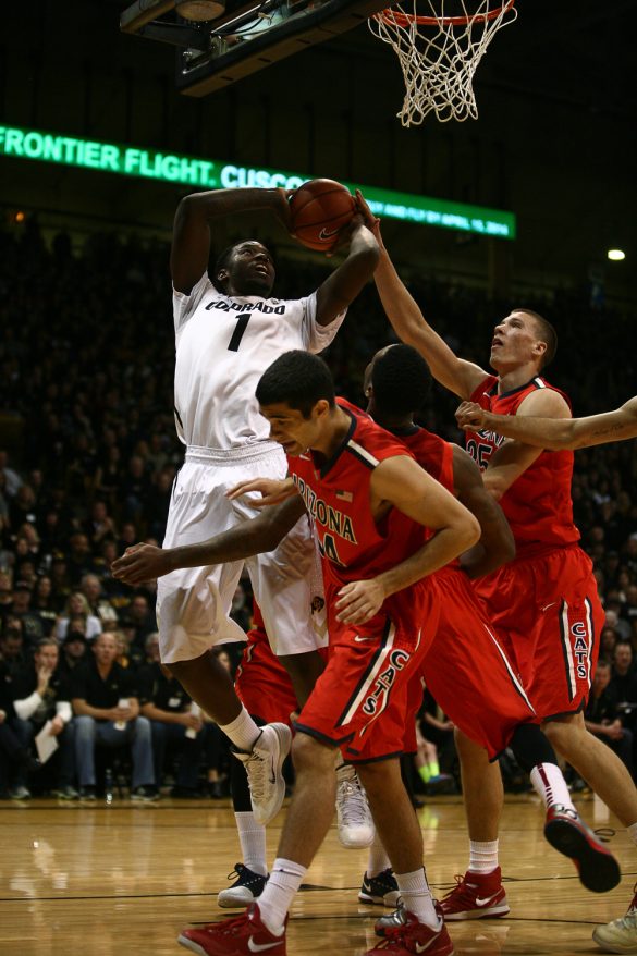 Colorado redshirt freshman Wesley Gordon (1) puts a shot up over three Arizona defenders during an NCAA college basketball game between the Colorado Buffaloes and the No. 4 Arizona Wildcats at the Coors Events Center, Saturday, Feb. 22, 2014, in Boulder, Colo. (Kai Casey/CU Independent)