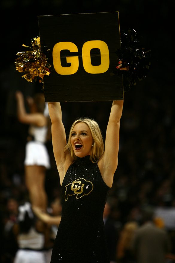 A Colorado cheerleader leads the crowd in a chant during a timeout during an NCAA college basketball game between the Colorado Buffaloes and the No. 4 Arizona Wildcats at the Coors Events Center, Saturday, Feb. 22, 2014, in Boulder, Colo. (Kai Casey/CU Independent)